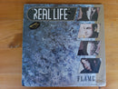 Real Life – Flame (RSA EX) Sealed