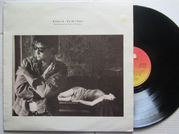 Paul Young | Between Two Fires (RSA VG+)